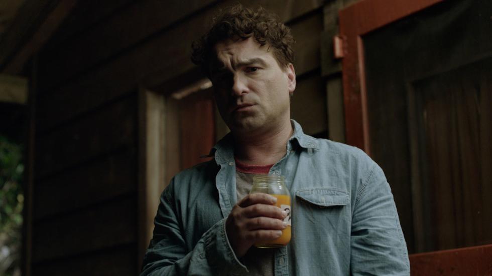 The Master Cleanse film still man holding a smoothie drink in a glass.
