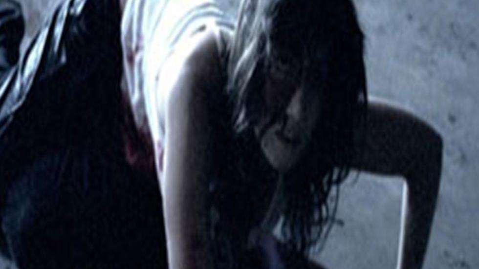 Undisclosed a woman crawls in fear