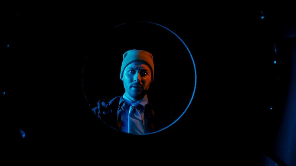 Mike looks into a hole