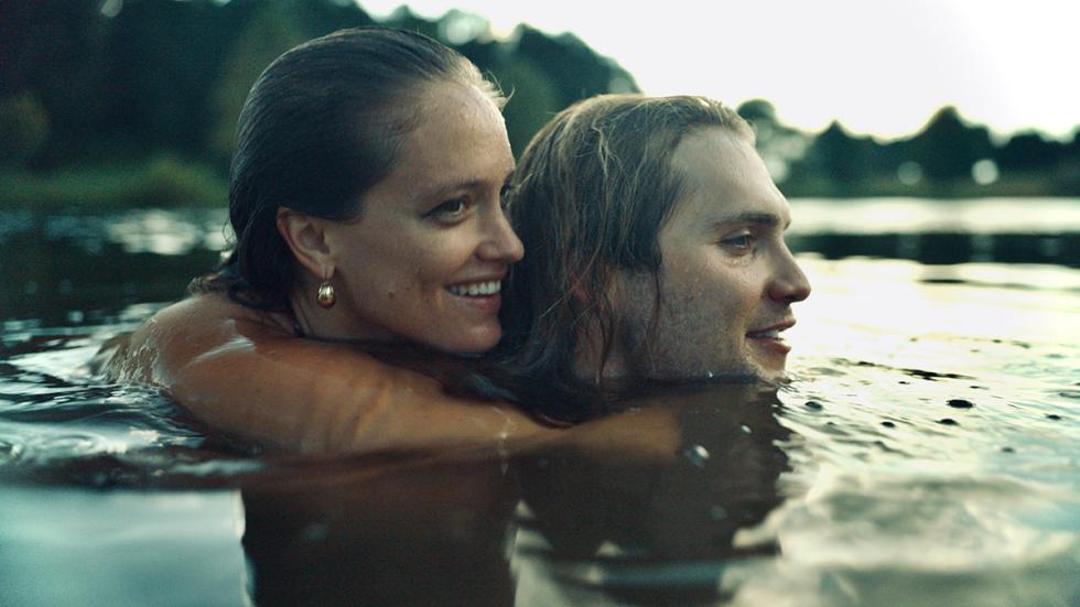 Wicked Games film still couple holding each other in a lake